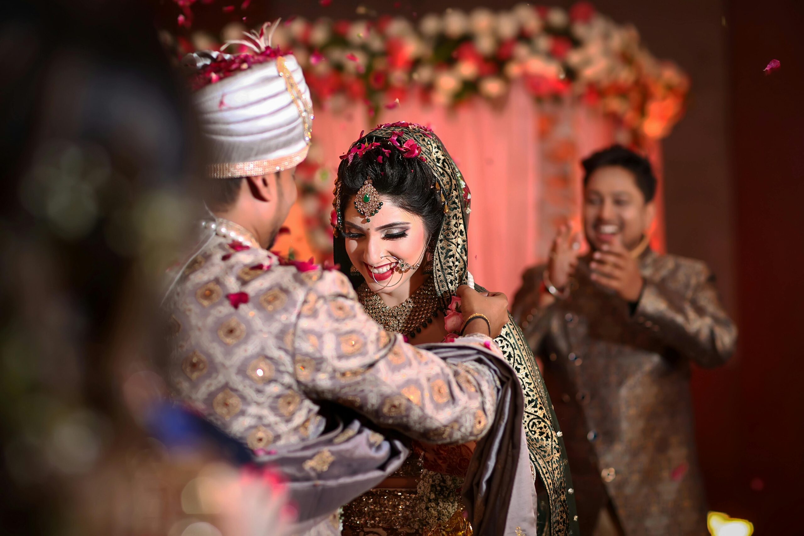 Joyful Indian couple sharing a heartfelt moment during their wedding ceremony.