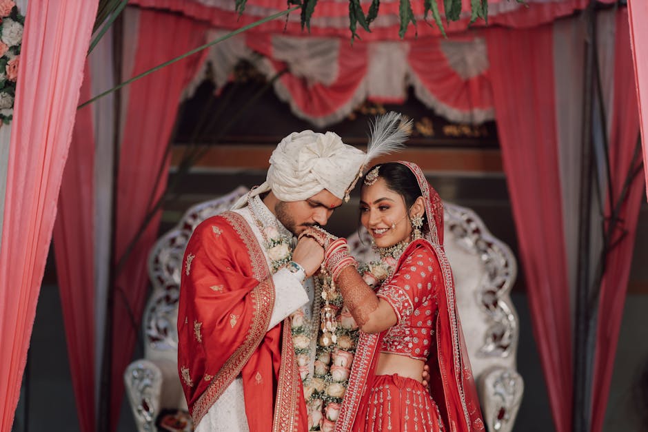 A romantic moment between an Indian bride and groom during their traditional marriage ceremony.